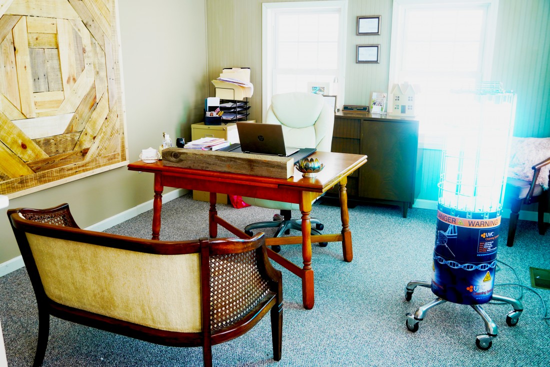 Empty office space with chair and, desk, computer, UVC unit, and other items